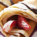crepes with slices of strawberry