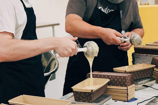 scooping batter into loaves